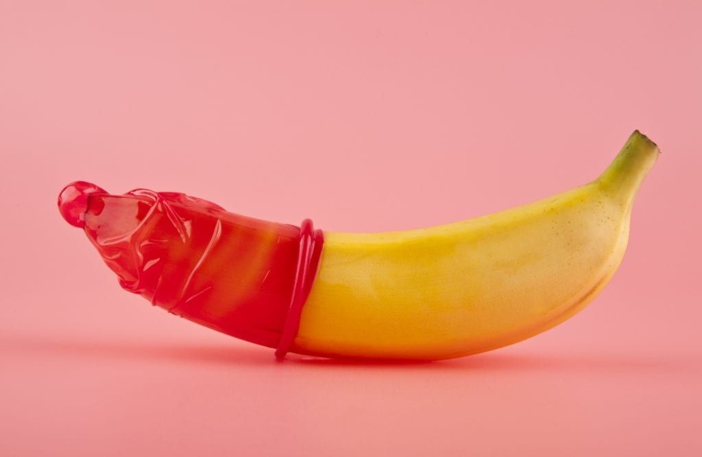 male condom shown on a banana 